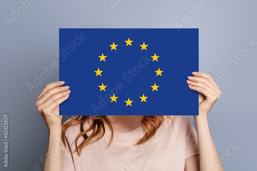 woman holds blank white speech bubble with european union flag isolated