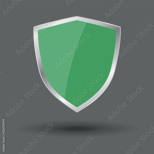 Free Download Green shield in metal frame. Vector isolated on gray background - GFXLoad