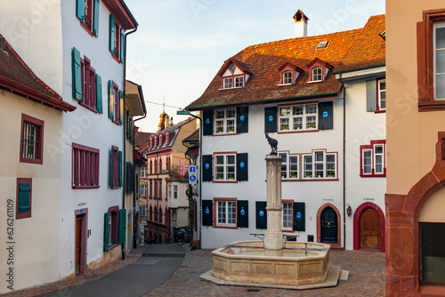 Gemsbrunnen fountain surrounded by the beautiful medieval houses. old town, Gemsberg street, Grossbasel district, city of Basel, Switzerland, Europe photo