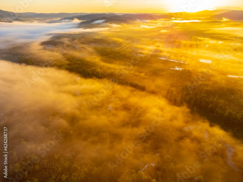 Photos of the hills and the village were taken from a drone in the early morning. Kuldur is an urban—type settlement in the Irradiation district of the Jewish Autonomous Region of Russia. Resort. 