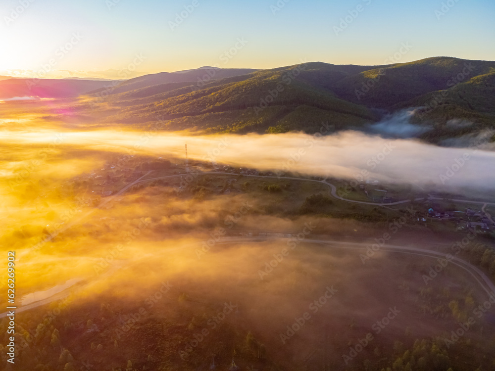 Photos of the hills and the village were taken from a drone in the early morning.  Kuldur is an urban—type settlement in the Irradiation district of the Jewish Autonomous Region of Russia. Resort. 