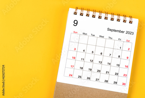 A September 2023 Monthly desk calendar for 2023 year on yellow background.