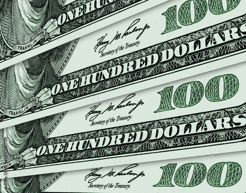 One hundred US dollar bills spread out like a fan