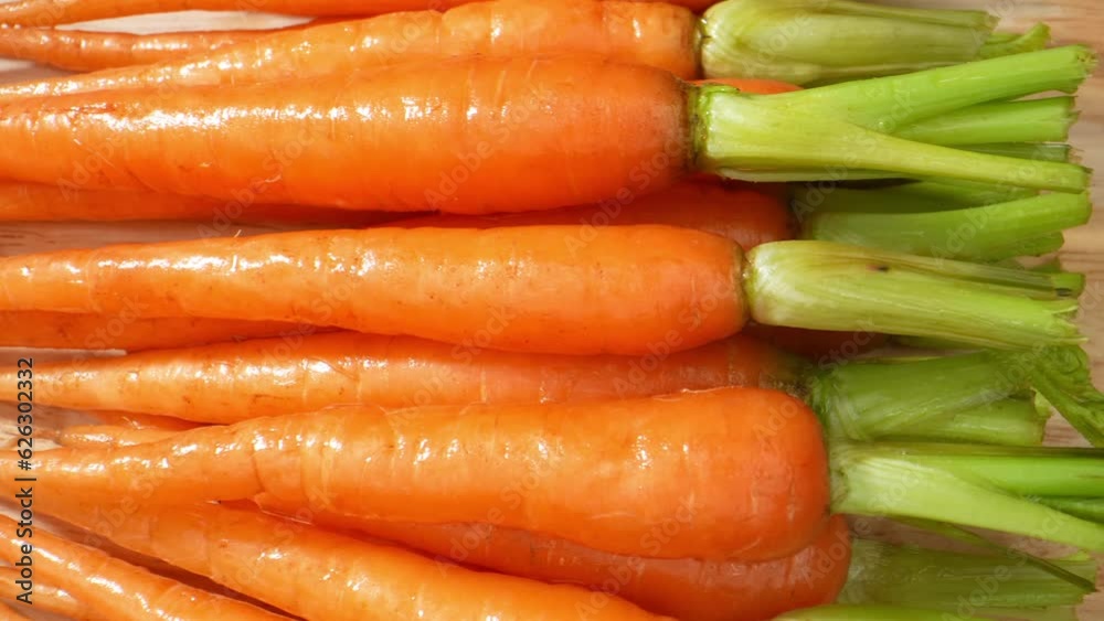 Tiny, crunchy baby carrots enchant in this mesmerizing macro video. Captured with a probe lens, witness their vibrant colors and intricate textures up close. Food and vegetable concept. Macro Tiny, crunchy baby carrots enchant in this mesmerizing macro video. Captured with a probe lens, witness their vibrant colors and intricate textures up close. Food and vegetable concept. Macro