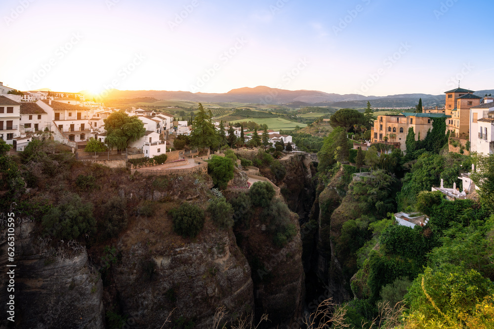 El Tajo Canyon at sunrise with Cuenca Gardens, Casa del Rey Moro and Puente Viejo Bridge - Ronda, Andalusia, Spain