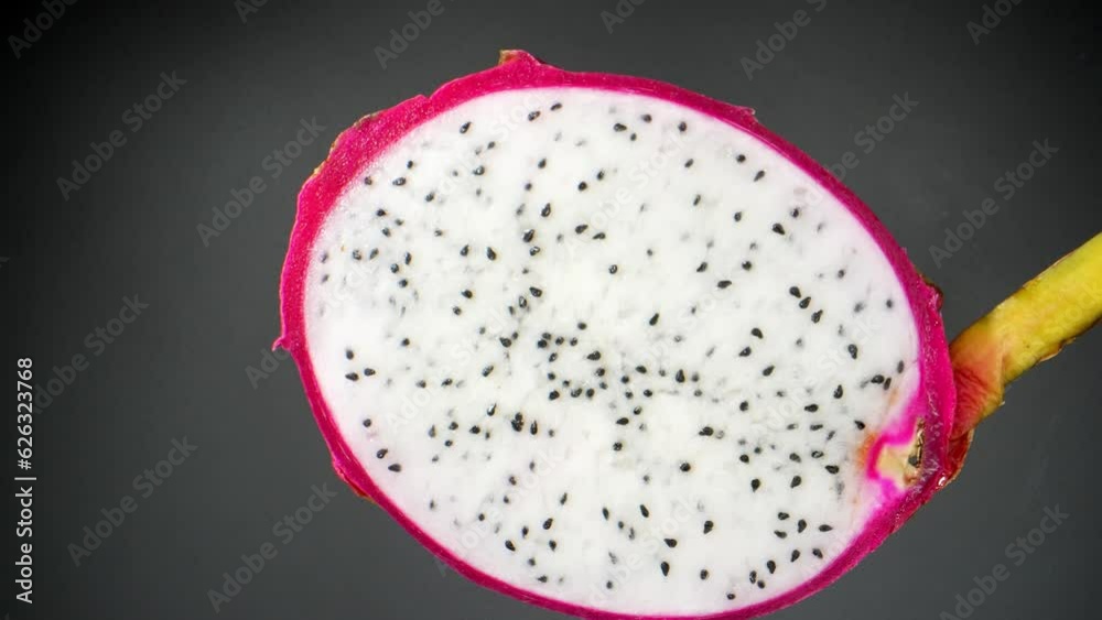 Macro video shot with a probe lens, explore the mesmerizing world of a half dragon fruit as its vibrant colors, intricate seeds, and succulent flesh reveal a tantalizing blend of delectable taste.
Macro video shot with a probe lens, explore the mesmerizing world of a half dragon fruit as its vibrant colors, intricate seeds, and succulent flesh reveal a tantalizing blend of delectable taste.