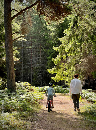 mother and son in the woods a beautiful morning