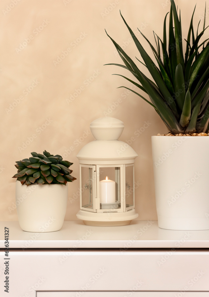 decorative lamp with a candle on a beige background