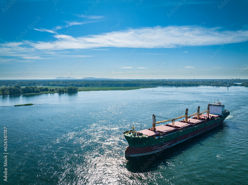 Aerial view of a cargo ship near the Port of Montreal on the St. Lawrence River