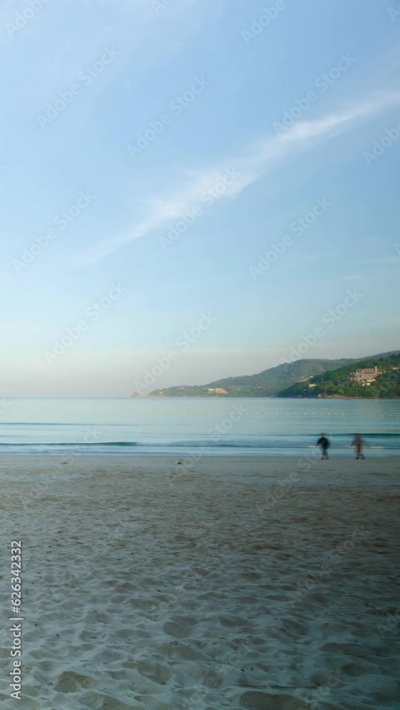 veritcal timelapse tropical white sand smooth beach with calm sea ocean and sunrise clear blue sky background.tropical white sand beach with blue sky and white cloud background veritcal timelapse tropical white sand smooth beach with calm sea ocean and sunrise clear blue sky background.tropical white sand beach with blue sky and white cloud background