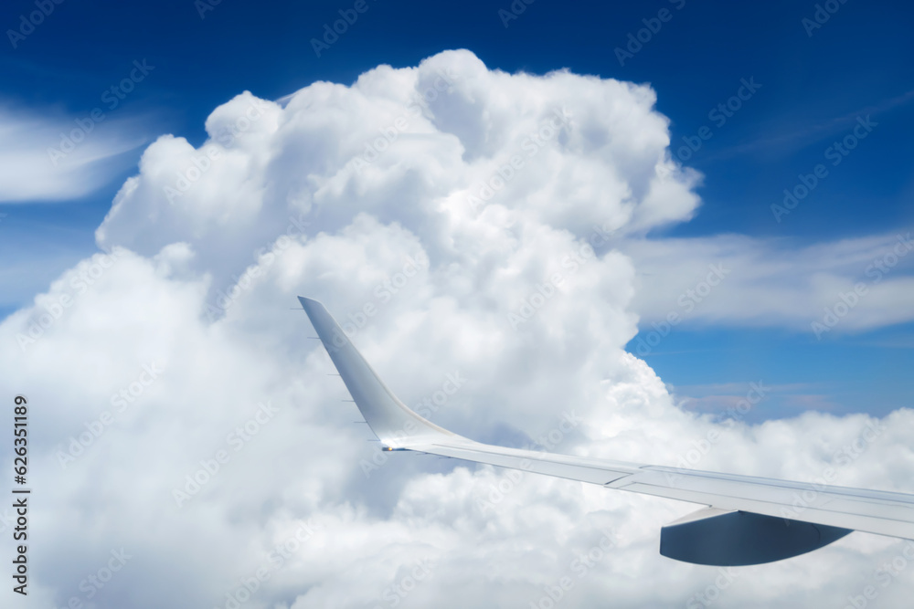 beautiful blue sky with soft clouds and plane wing as abstract background, bird's-eye view from an airplane window, travel concept beautiful blue sky with soft clouds and plane wing as abstract background, bird's-eye view from an airplane window, travel concept