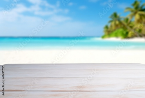 White wooden table top on blur beach background - can be used for display or montage your products © oksa_studio
