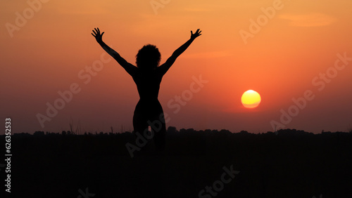 silhouette of a person jumping free