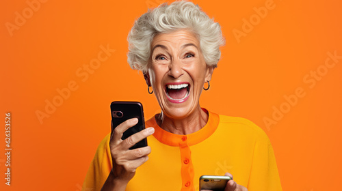 An elderly woman exited and shocked as she saw something on her phone against an orange background.