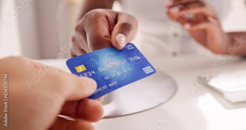 Cashier Hand Holding Debit Or Credit Card