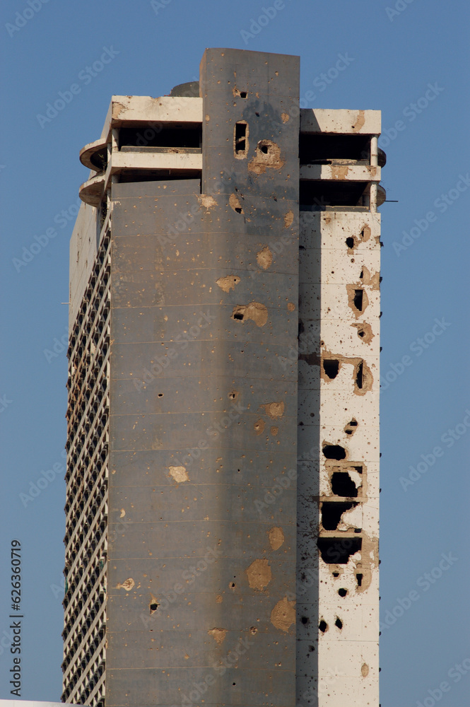 Fototapeta premium War damaged exterior of the former Holiday Inn, Beirut, Lebanon. Civil war in the Middle East