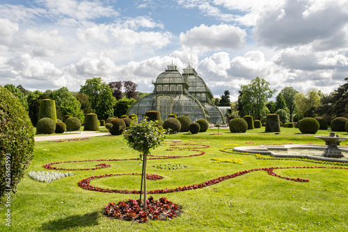 Greenhouse Palm House, Palmenhaus at Schonbrunn garden, historic glass building. photo