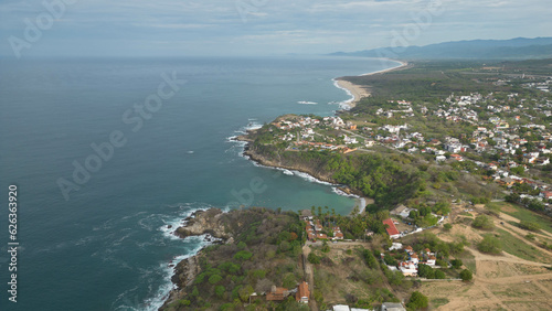 Above Ocean Pacific and houses by the sea near Carrizalillo beach, Puerto Escondido
