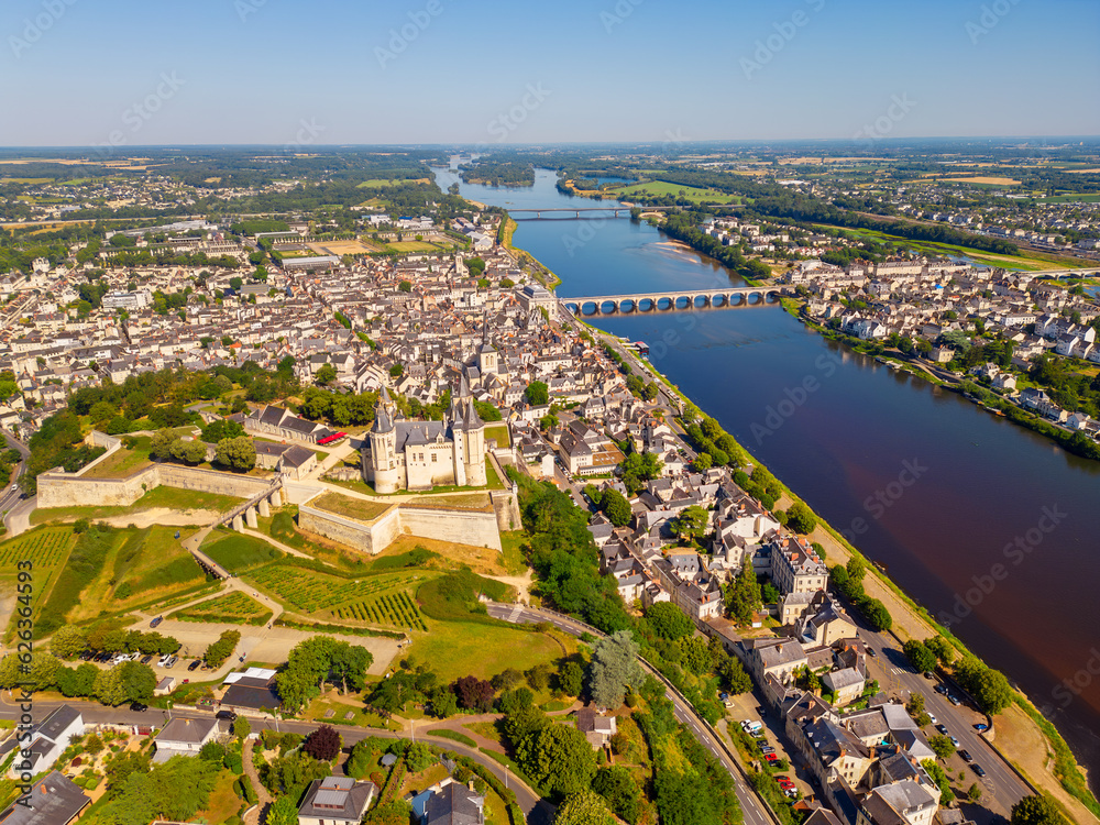 High angle Drone Point of View on the City of Saumur, Pays de la Loire, Northwestern France on summer day. The Loire River flows through Saumur.