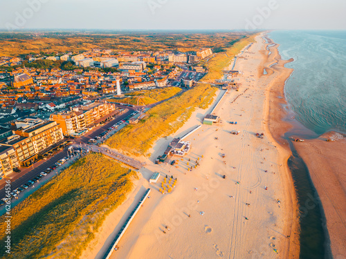 High angle Drone Point of View on Coastal Village of Egmond aan Zee, North-Holland, The Netherlands on spring day around sunset