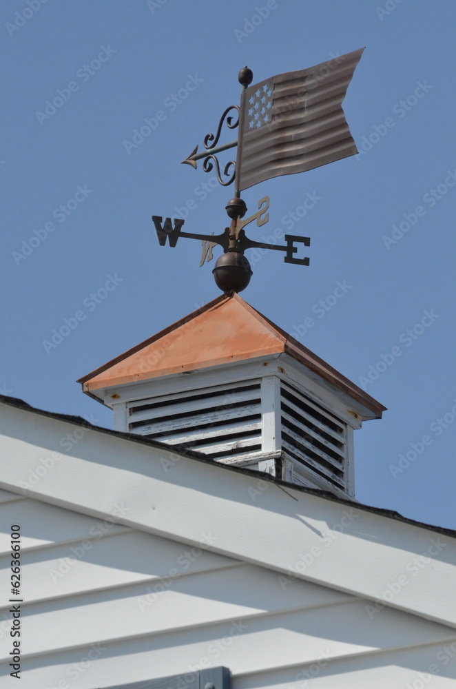 American flag weathervane on roof American flag weathervane on roof