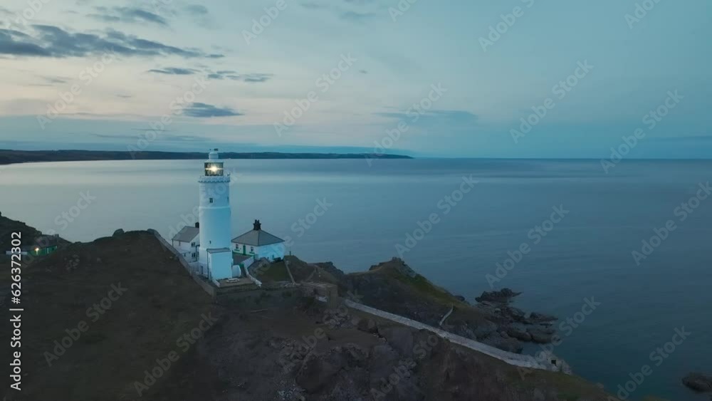 Sunset over Start Point Lighthouse from a drone, Trinity House and South West Coast Path, Devon, England Sunset over Start Point Lighthouse from a drone, Trinity House and South West Coast Path, Devon, England