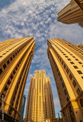 Photography View up to sky with fisheye lens of the hotel towers at JBR Beach in Dubai UAE