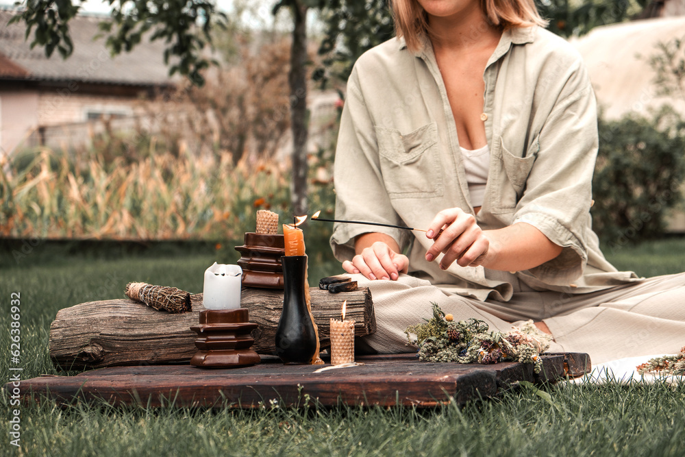 Woman Inhaling Incense Smoke During Meditation.Ground level of relaxed