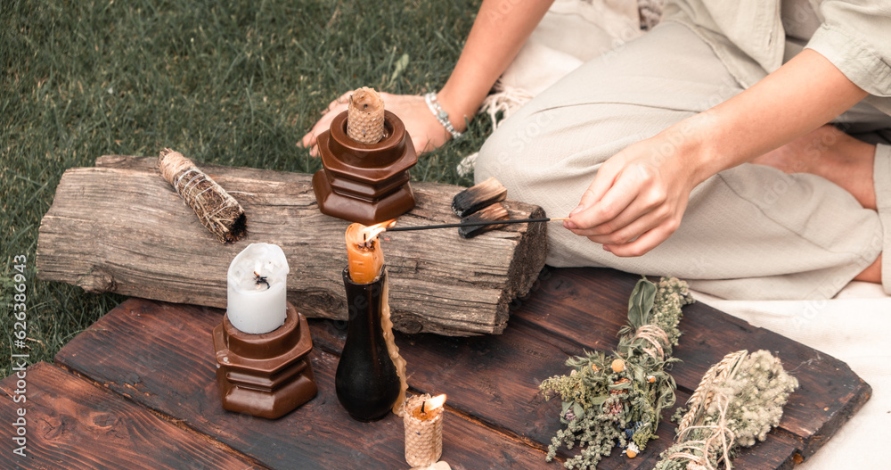 Woman Inhaling Incense Smoke During Meditation.Ground level of relaxed
