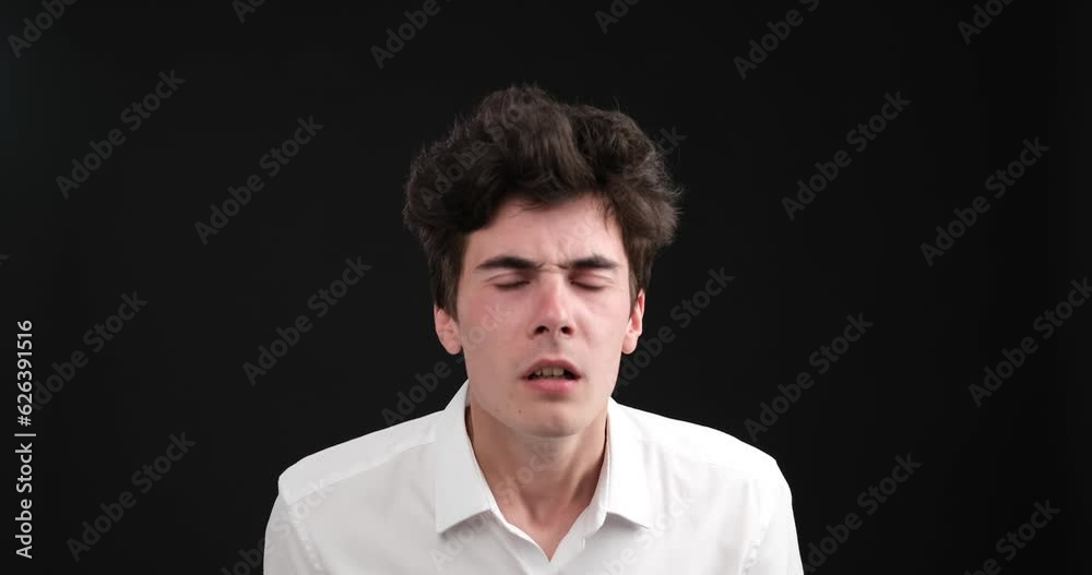 Against a captivating black background, a puzzled Caucasian man is captured in a moment of utter disbelief. His eyes widen, and his eyebrows furrow as he struggles to comprehend what he sees. Against a captivating black background, a puzzled Caucasian man is captured in a moment of utter disbelief. His eyes widen, and his eyebrows furrow as he struggles to comprehend what he sees.