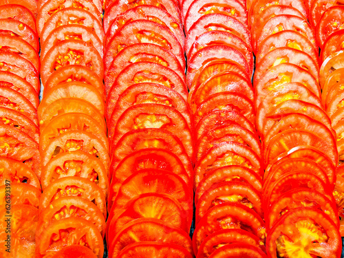 Sliced fresh tomato background. a lot of sliced. top view.