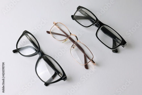glasses for vision correction on a light background with a place for text