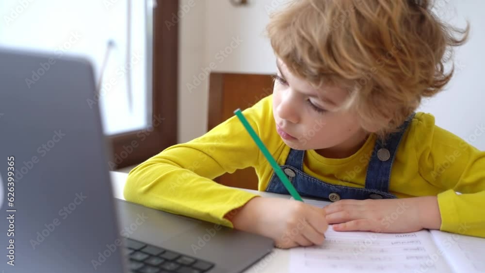 Close up Schoolboy child write exercise alphabet using laptop online educational lesson programming course at home. Distance learning remote video conference. Schoolgirl study does homework. Close up Schoolboy child write exercise alphabet using laptop online educational lesson programming course at home. Distance learning remote video conference. Schoolgirl study does homework.