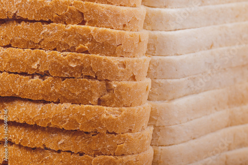 Sliced white bread with brown crust closeup.