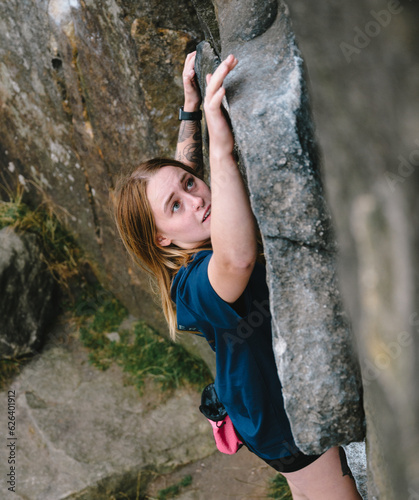 woman climbing on a rock