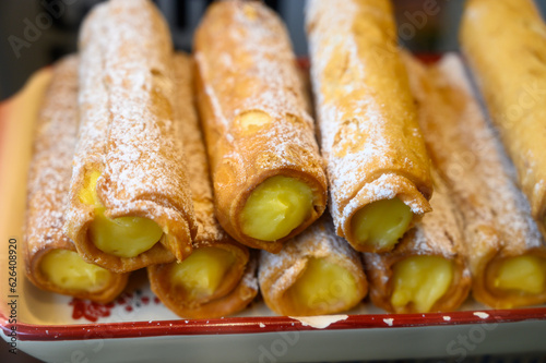 Fototapeta Naklejka Na Ścianę i Meble -  Fresh baked pastries and sweets on display in artisan Spanish confectionery shop
