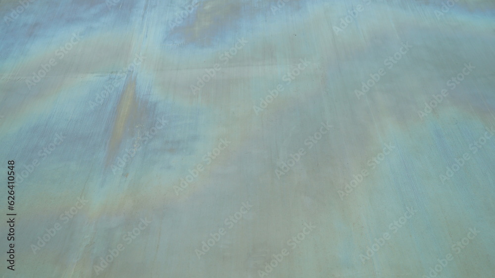 Naklejka premium The surface of an old, faded metal building