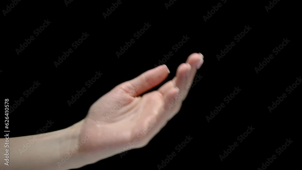 Female puffs hands disinfection antiseptic on black background. Female puffs hands disinfection antiseptic on black background.