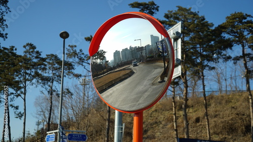 Traffic safety convex mirror on the street in Seoul photo