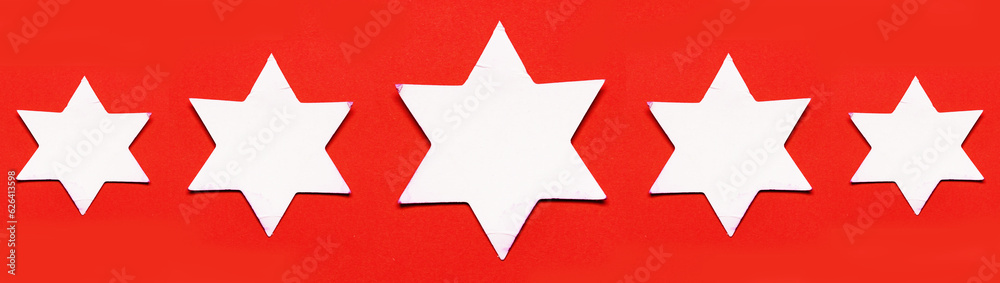 5 white stars paper on red background 5 white stars paper on red background