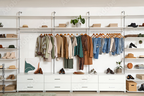 Wallpaper Mural Stylish clothes with shoes and accessories in light boutique Torontodigital.ca