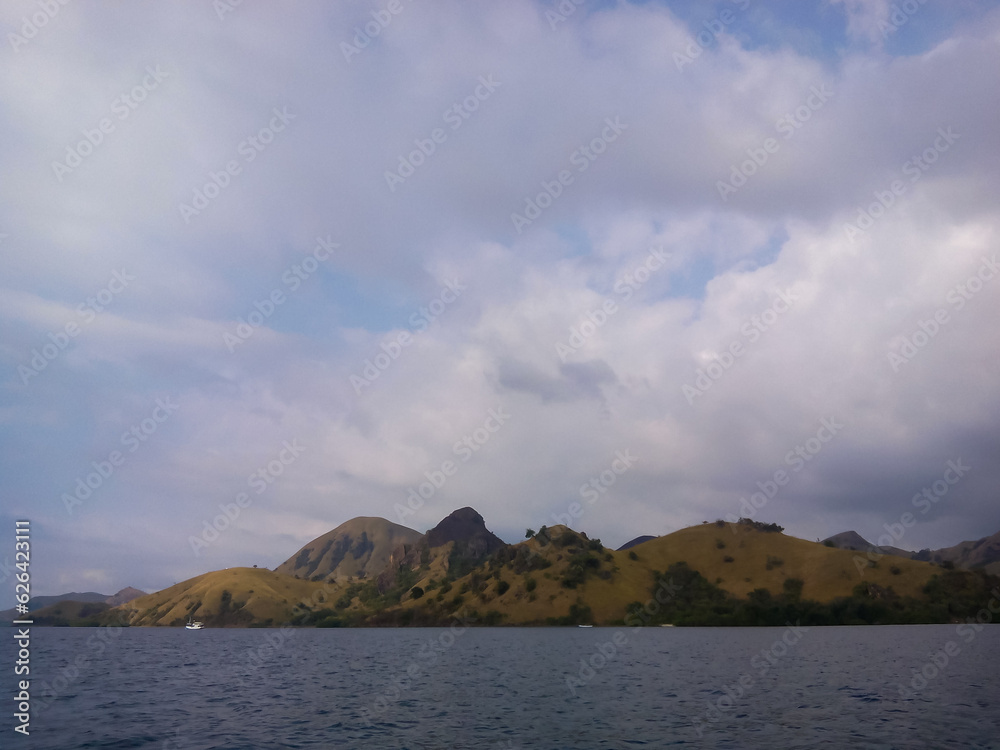 selective focus, natural view of an island against a clear sky.