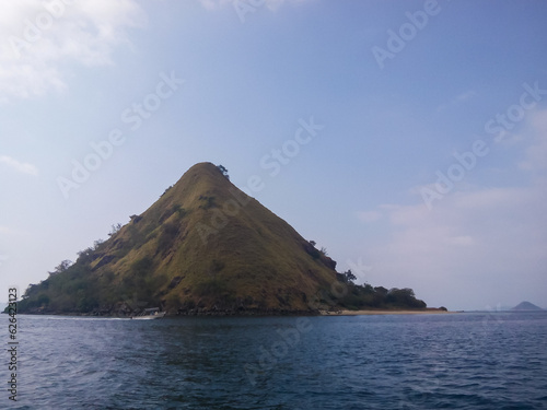 selective focus, natural view of an island against a clear sky.