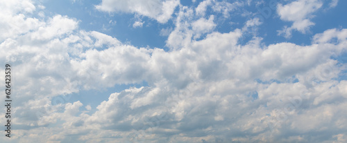 sky replacement panoramic looking up at sunny blue sky with white clouds