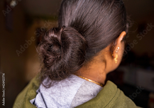 Bun hairstyle close up. woman close-up rear view. 22 july 2023 - Mudigere karnataka india