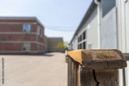 Canvas Print School exterior portable classroom wooden handrail outside - close up - blurred background