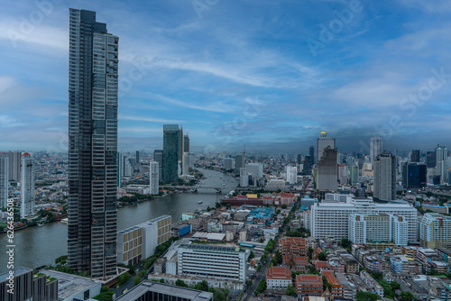 Condominium buildings, houses, expressway roads in the middle of the city. High angle view of the capital city of Bangkok, 