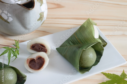 Sasa dango  is dark green dango with a flavor of Japanese mugwort wrapped in fresh bamboo leaves. 