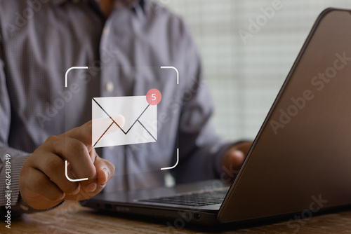 New email notification concept for business e-mail communication and digital marketing. Inbox receiving electronic message alert. business person touch on email in virtual screen. internet technology. photo