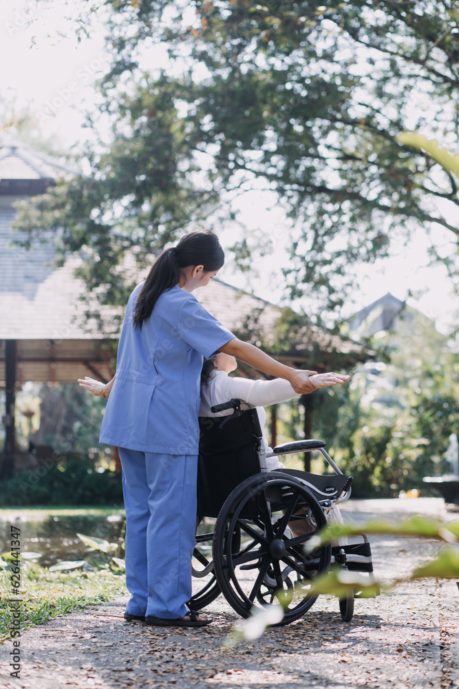 young asian physical therapist working with senior woman on walking with a walker young asian physical therapist working with senior woman on walking with a walker